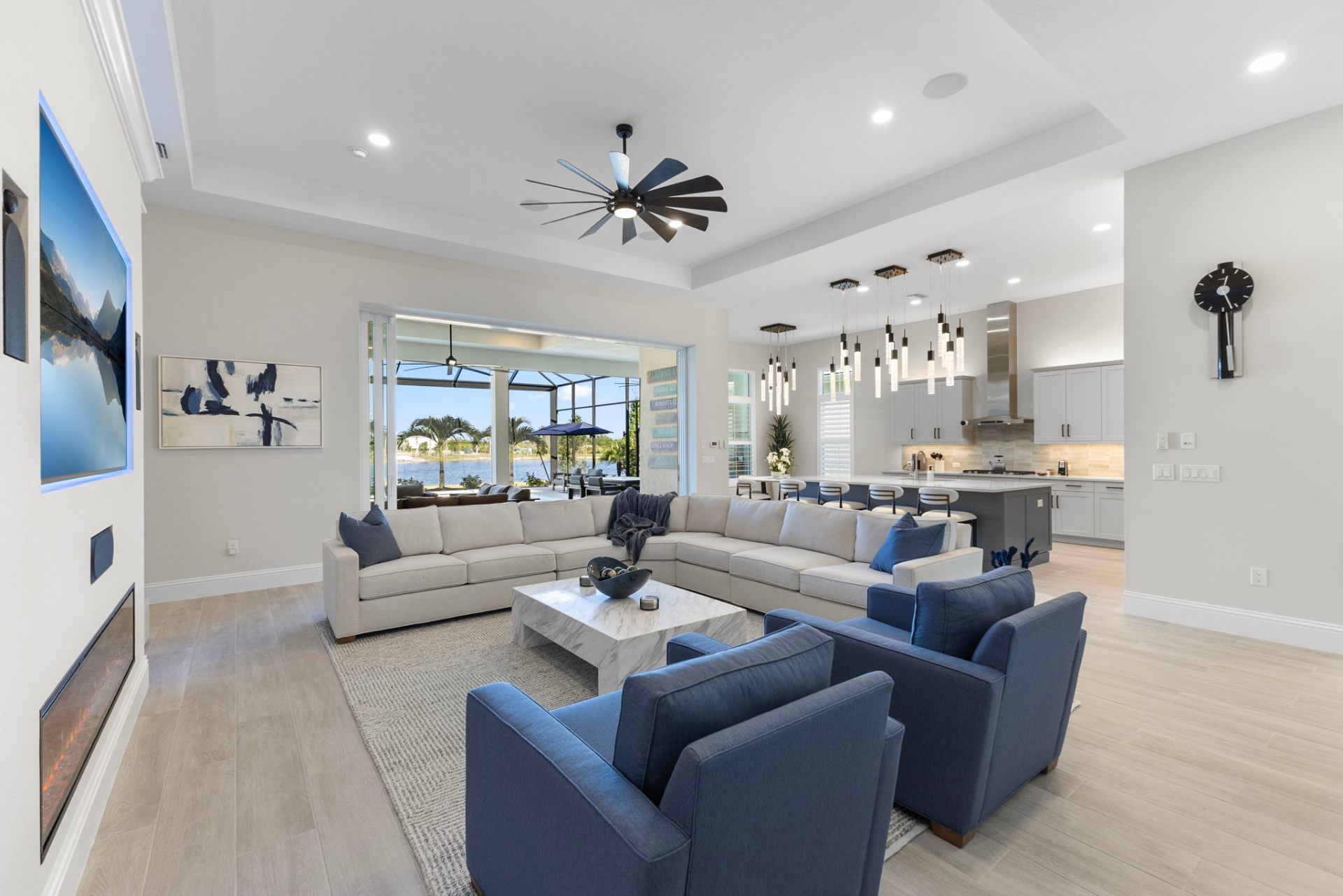 Great room opening to the kitchen with custom pendant lighting