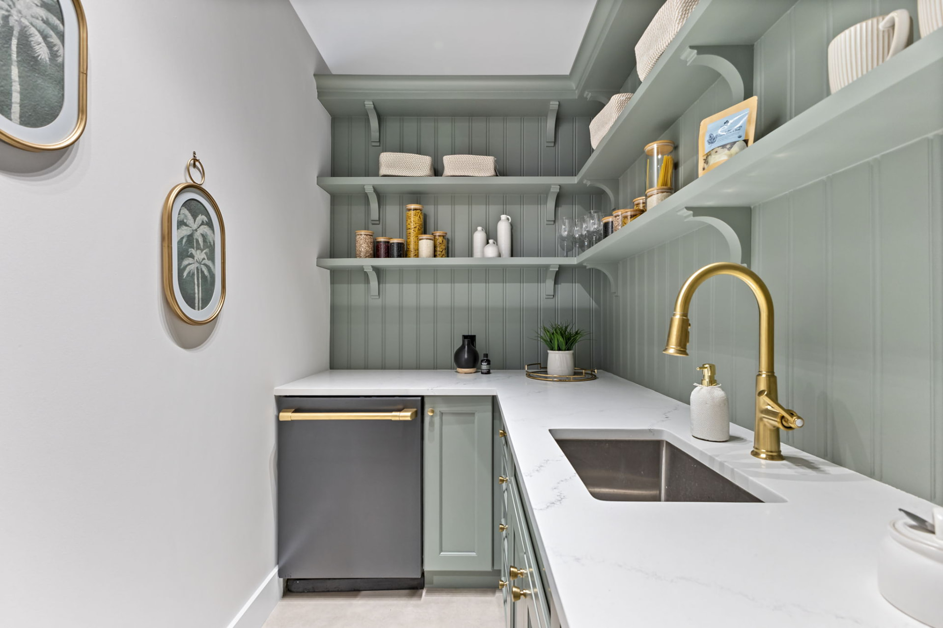 Walk-in pantry with tongue-and-groove paneling, prep sink and integrated dishwasher