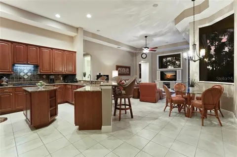Before — original kitchen layout with breakfast bar separating the family room