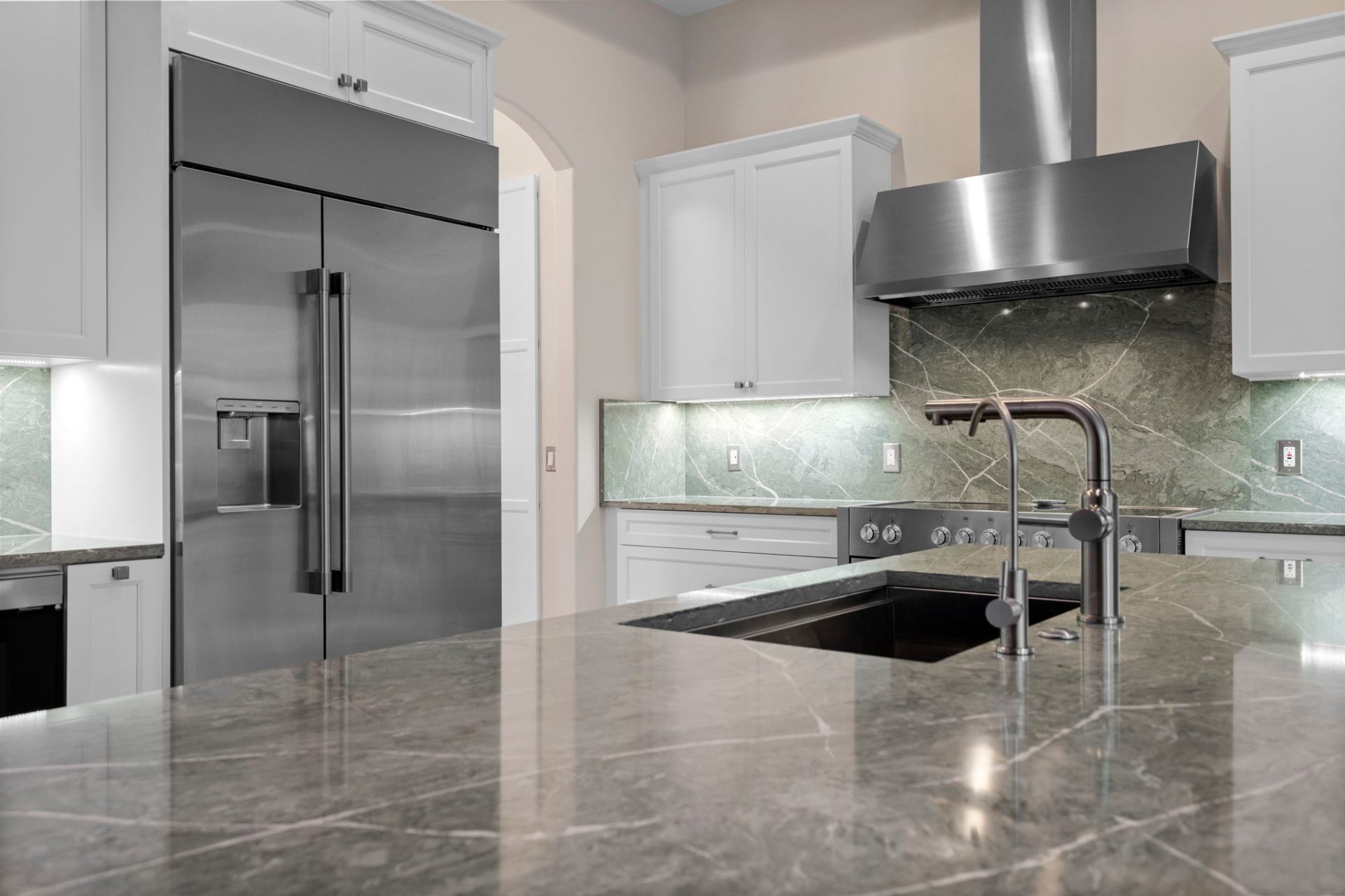 Pompeii quartz island and stainless steel range hood