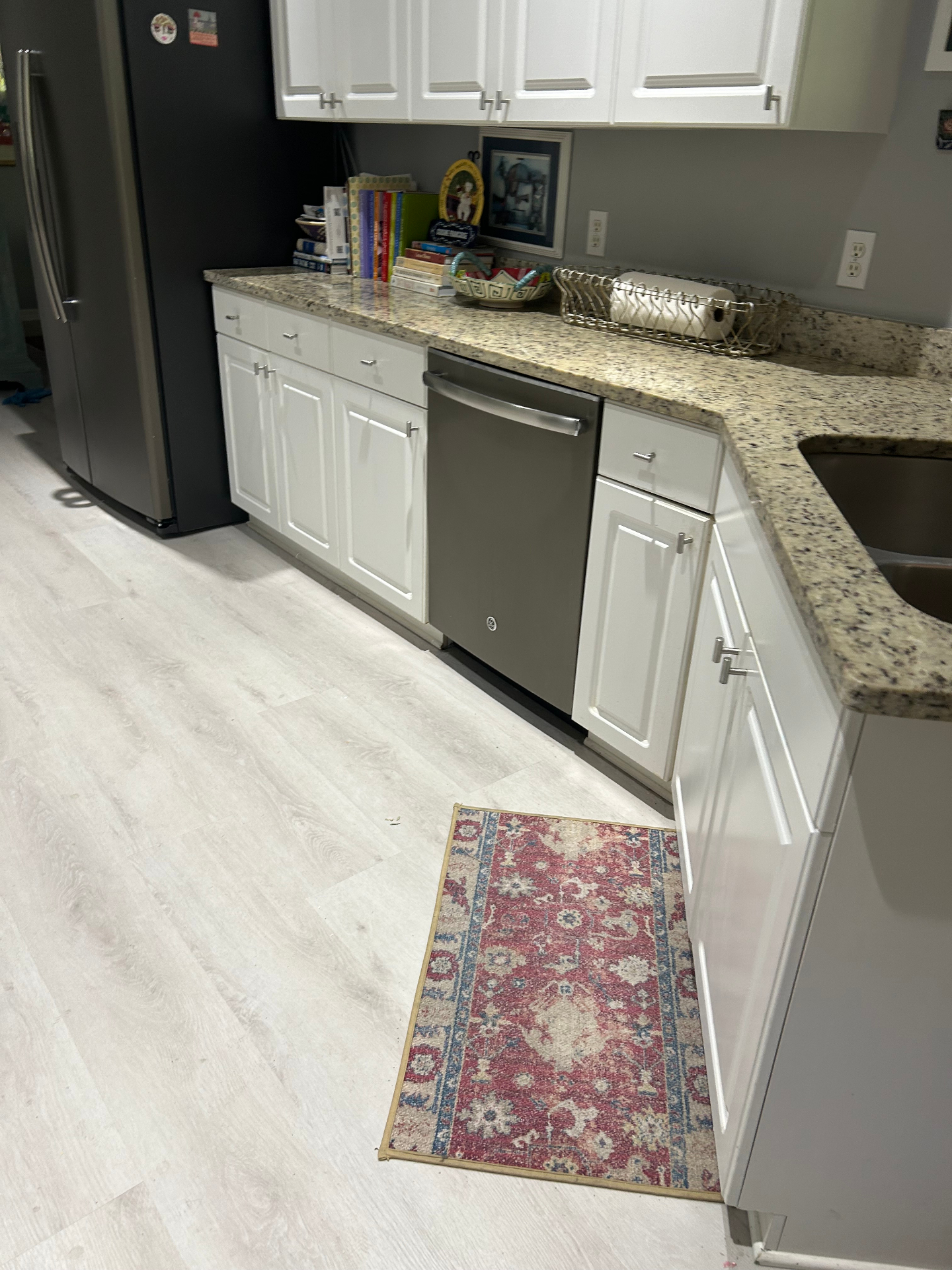Before — original lower cabinetry and dishwasher run
