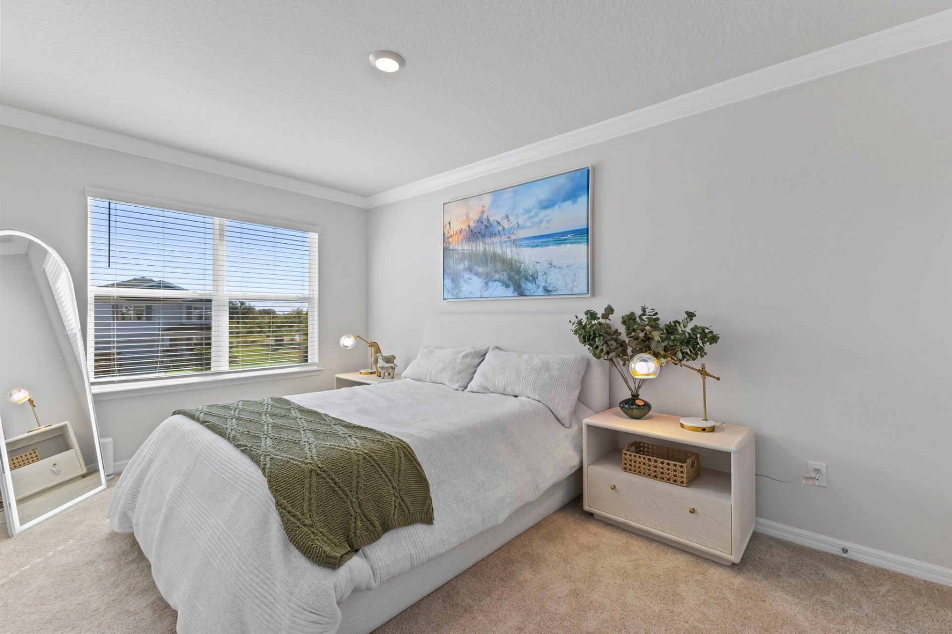 Guest bedroom with sea-grass artwork and curated nightstand styling
