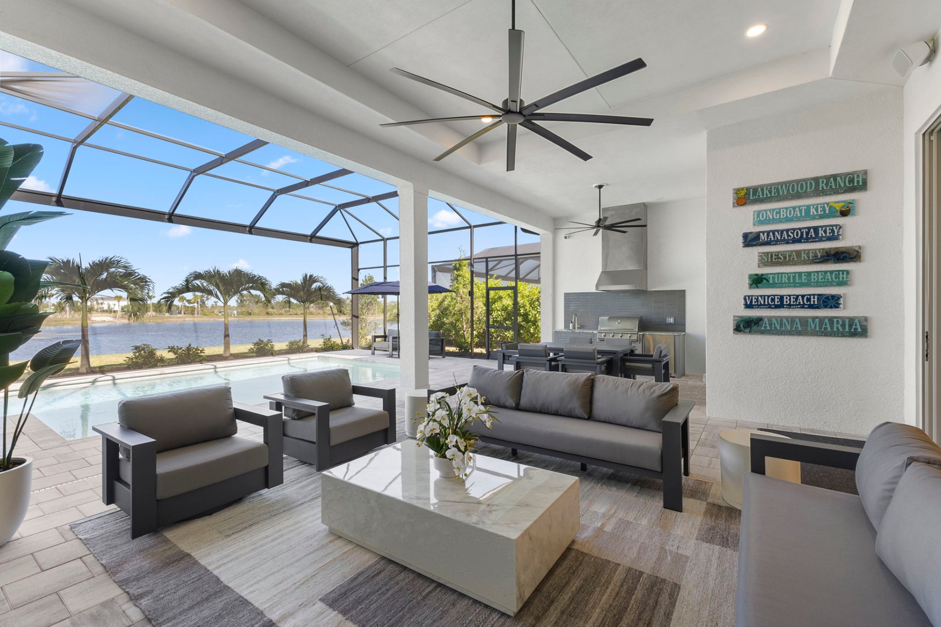 Poolside lounge with Florida coastal signage and lake views