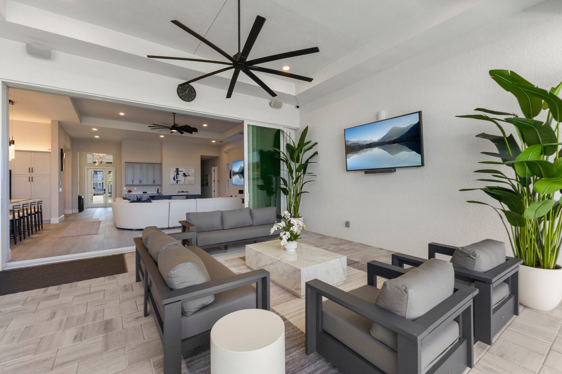 Covered lanai lounge opening to the great room interior