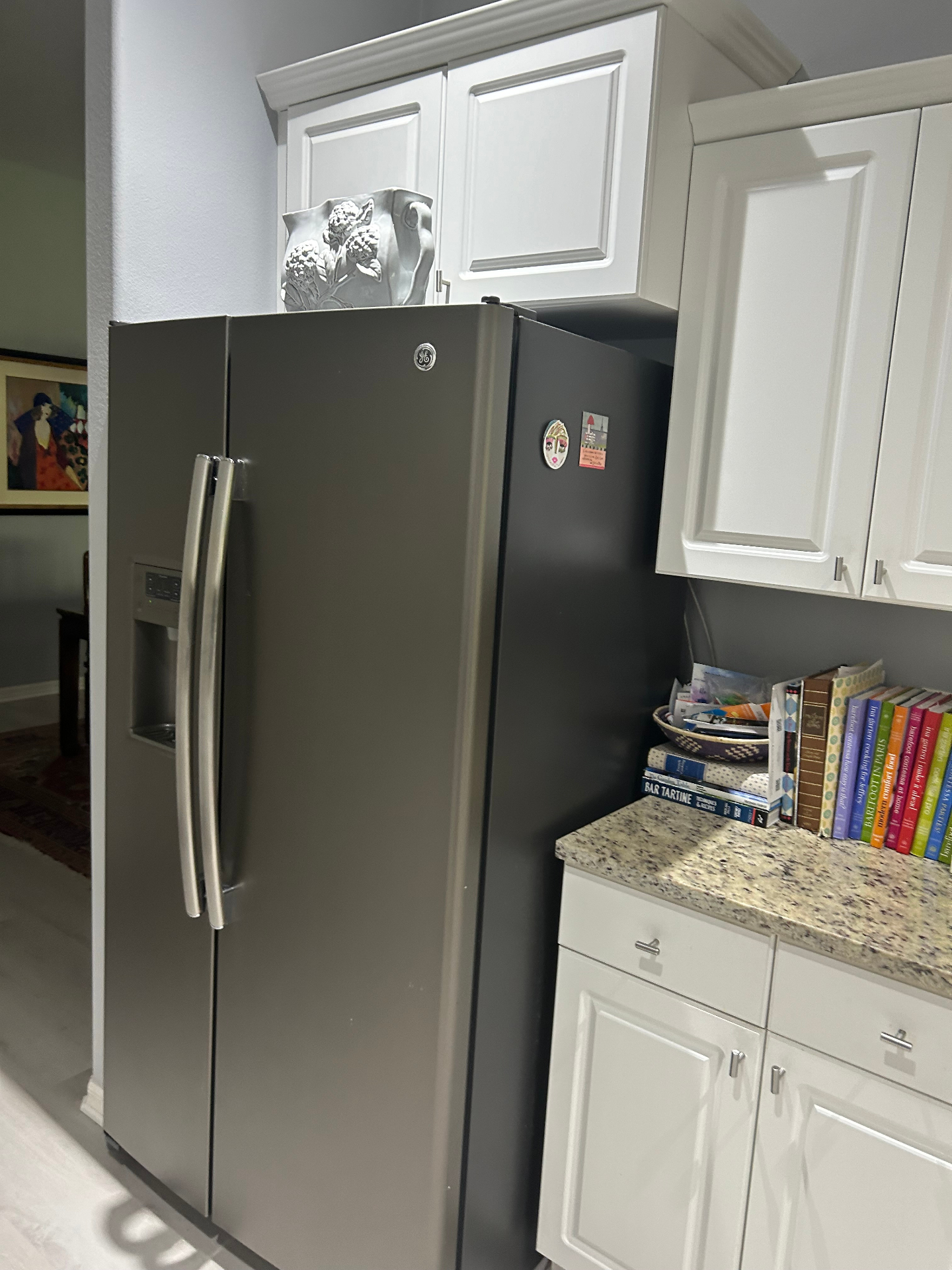 Before — original refrigerator wall and upper cabinetry