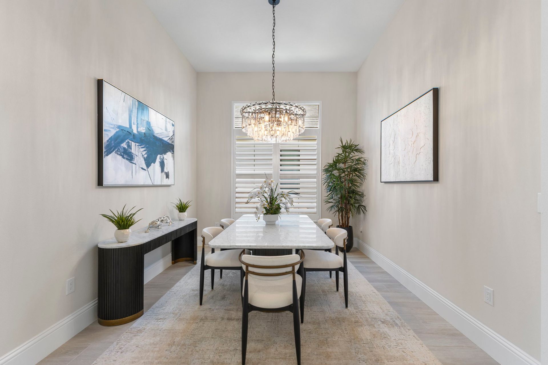 Formal dining room with crystal chandelier and custom console