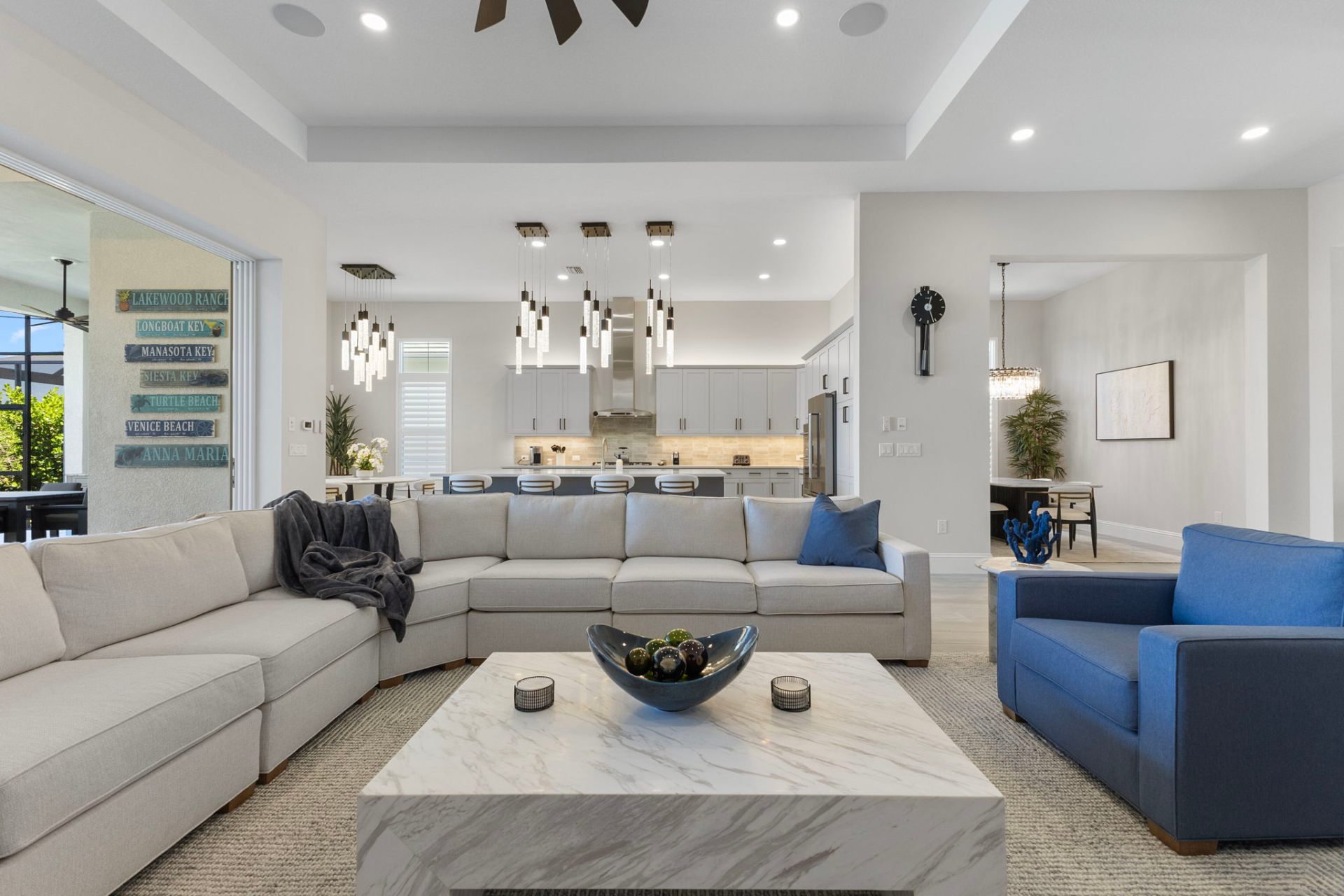 Open-concept living and kitchen with custom shaker cabinetry
